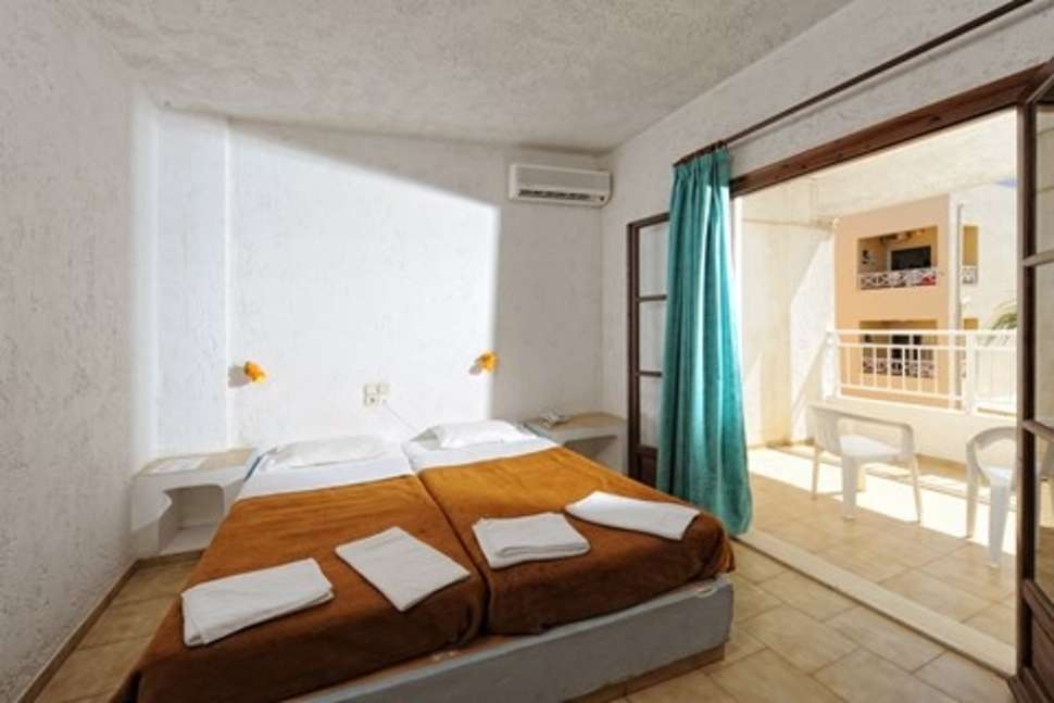 Slaapkamer van appartement van Appartementen Neptune in Chersonissos, Kreta