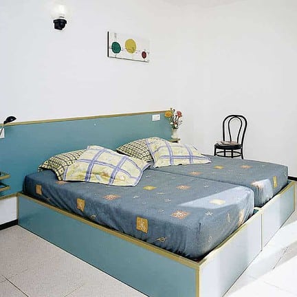 Slaapkamer van Appartementencomplex Xaine Sun in Lloret de Mar, Costa Brava, Spanje