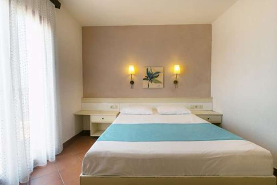 Slaapkamer van appartement van Ida Village Resort in Chersonissos, Kreta