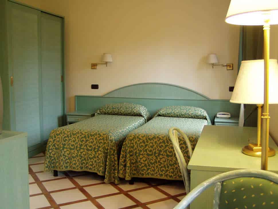 Slaapkamer in Bungalow van Villagio Verde in Sorrento, Italië